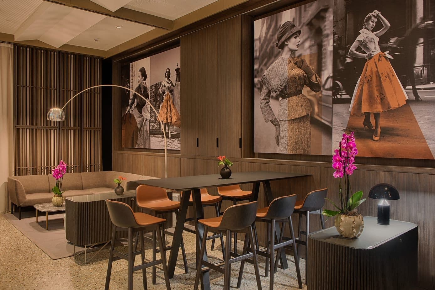 NH-restaurant-jpeg Stylish modern lounge with vintage fashion photos, elegant furniture, and vibrant orchids for a chic ambiance. | Sky Rye Design Stylish modern lounge with vintage fashion photos, elegant furniture, and vibrant orchids for a chic ambiance.