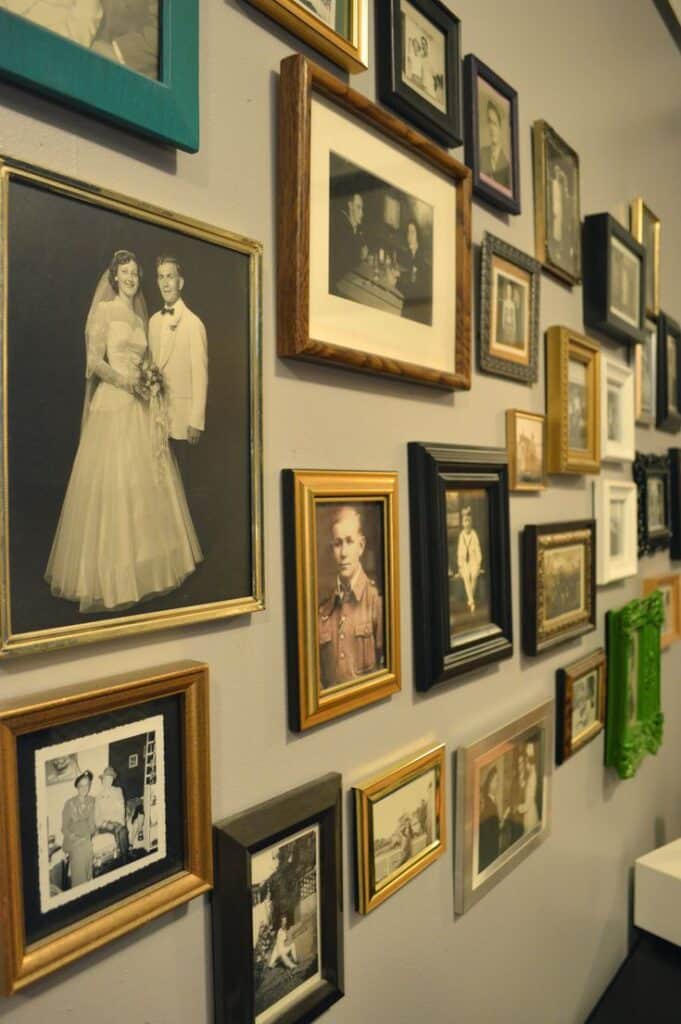 Old family pictures varied frames Wall of vintage framed photographs showcasing family memories and history in a variety of styles and sizes. | Sky Rye Design Wall of vintage framed photographs showcasing family memories and history in a variety of styles and sizes.