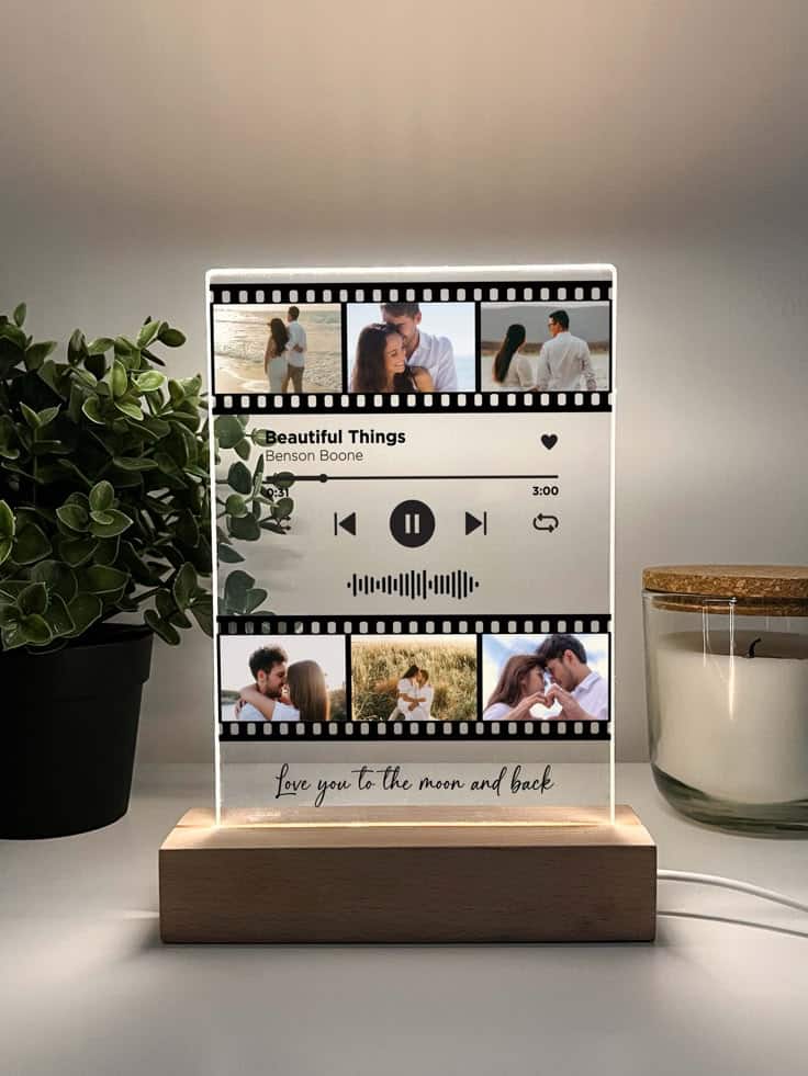 Personalized Song Movie Film Night Light with Photo and Wooden Base Besties Photo Gifts Photo Keepsake Photo Gifts Personalized Gift for BFF Birthday Personalized acrylic music plaque with romantic photos, song display, and wooden base, surrounded by plants and a candle. | Sky Rye Design Personalized acrylic music plaque with romantic photos, song display, and wooden base, surrounded by plants and a candle.