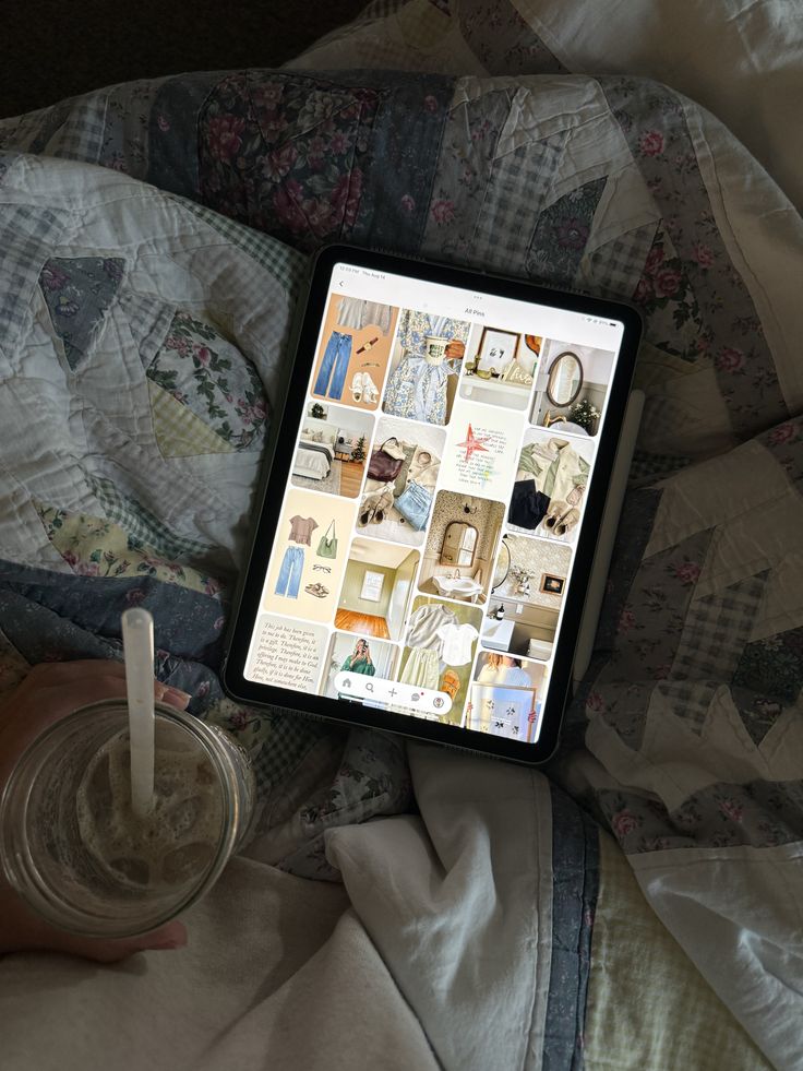 Tablet with lifestyle mood board on a quilt blanket next to iced drink in a jar.