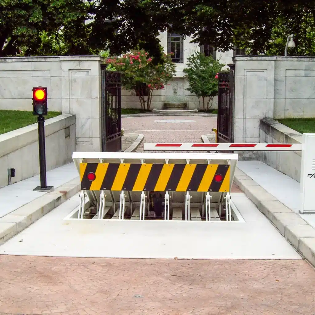 Sentinel-Slide-4 Security barrier and gate with red light at entrance to a restricted area. | Sky Rye Design Security barrier and gate with red light at entrance to a restricted area.