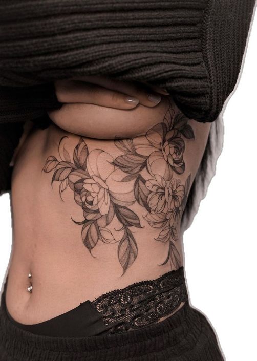 Tattoos for women ❤️_🔥 Floral side tattoo design on a person's torso, featuring intricate black ink flowers and leaves for a delicate look. | Sky Rye Design Floral side tattoo design on a person's torso, featuring intricate black ink flowers and leaves for a delicate look.