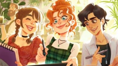 Three animated friends drawing and laughing together in a sunny cafe.