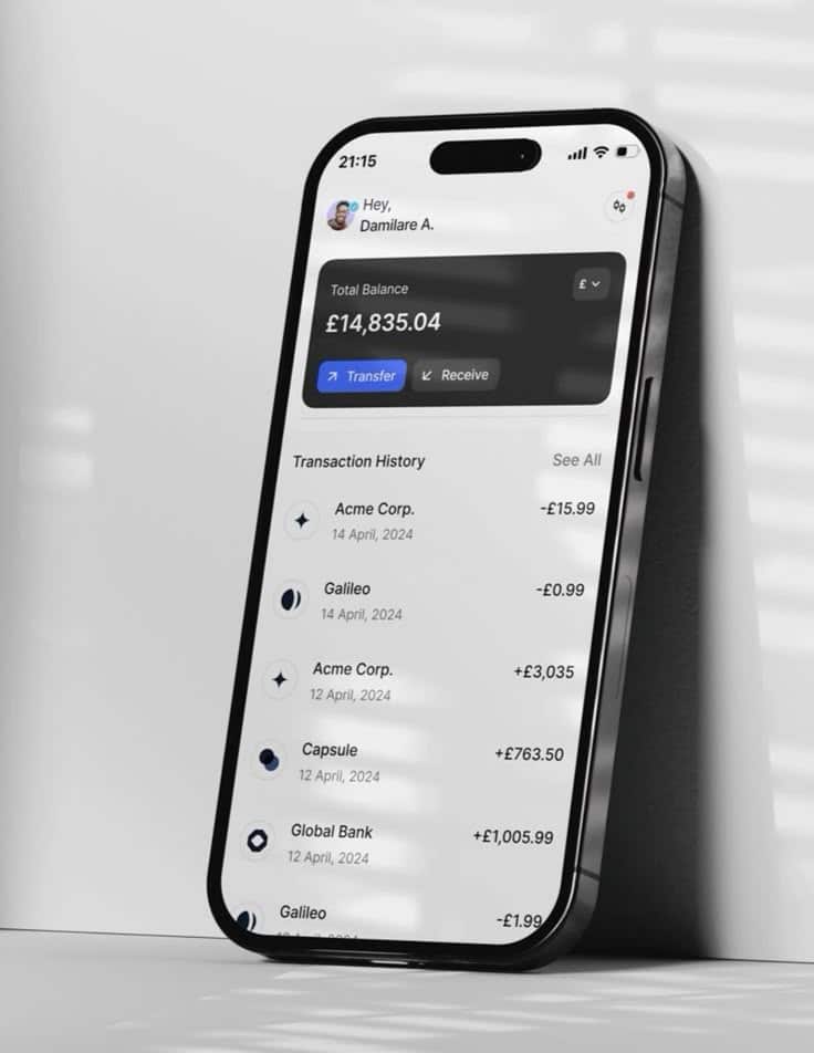 Smartphone displaying a banking app with a balance of £14,835.04 and recent transactions listed.
