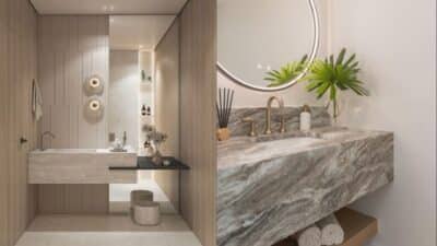 Modern bathroom with marble sinks, round mirror, and elegant decor. Warm lighting and natural accents create a serene atmosphere.