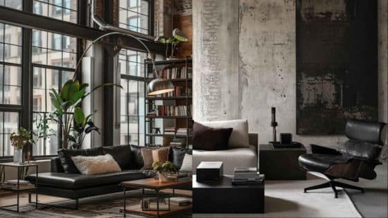 Viewing Deck Blog Modern industrial living room with large windows, black leather sofa, green plants, and stylish decor elements. | Sky Rye Design Modern industrial living room with large windows, black leather sofa, green plants, and stylish decor elements.