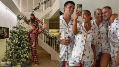 Friends in festive pajamas decorating a Christmas tree and taking a selfie. Holiday celebration and merriment indoors.