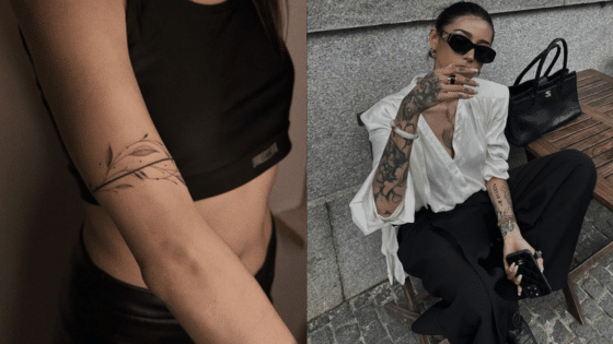 Woman with floral tattoo on arm and stylish outfit, showcasing modern fashion and ink art.