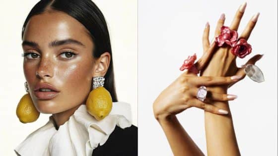 Model wears unique lemon earrings and floral rings, showcasing bold fashion accessories against a white background.