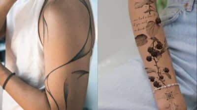 Abstract black tattoo on left arm and botanical tattoo with berries on right arm, both showcasing unique designs.