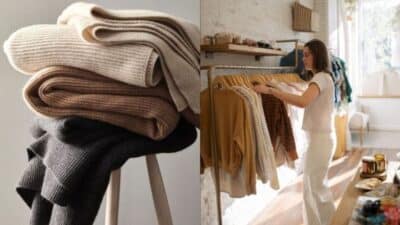 Stacked cozy knitwear and a woman browsing clothes in a boutique. Warm tones and stylish winter fashion.