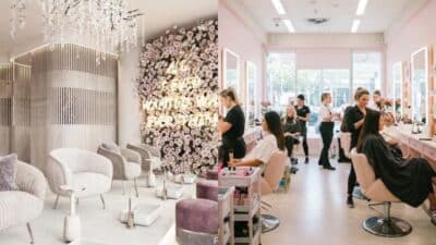 Luxurious salon interiors with floral wall and chandeliers, makeup artists working with clients.