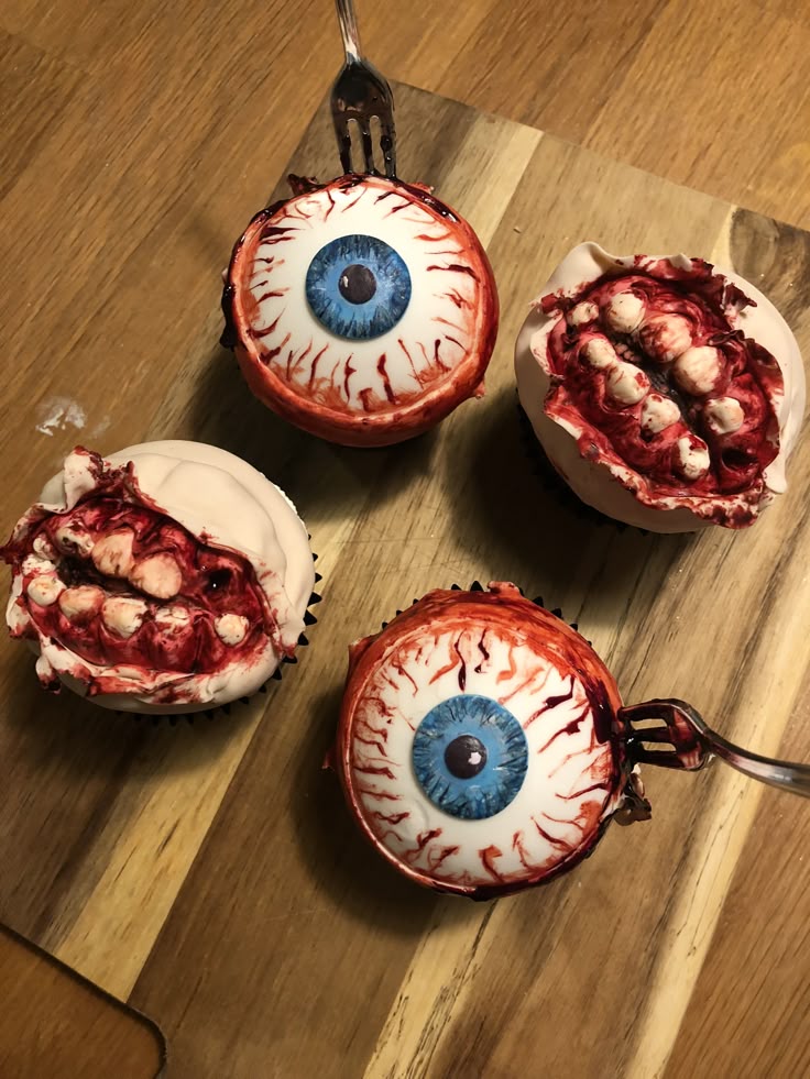 Zombie cupcakes Spooky Halloween cupcakes decorated as eyeballs and mouths on a wooden board. | Sky Rye Design Spooky Halloween cupcakes decorated as eyeballs and mouths on a wooden board.
