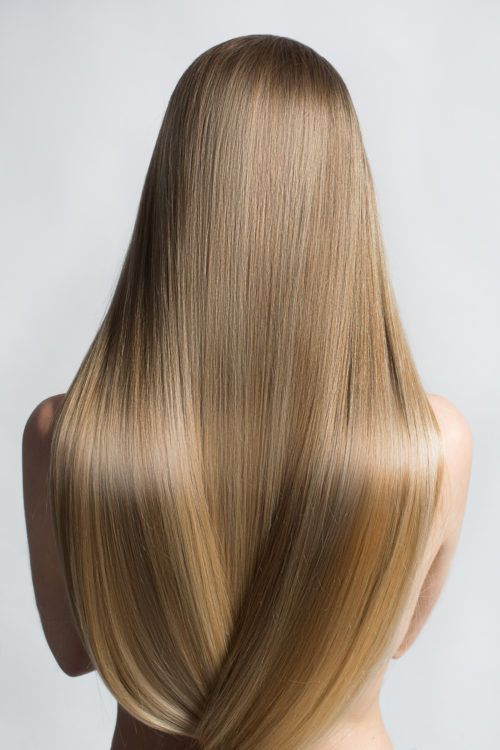 Long, smooth blonde hair cascading down the back, showcasing healthy, shiny locks against a neutral background.