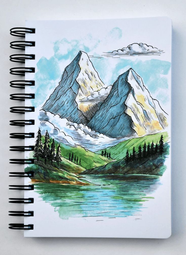 Sketch of snowy mountain peaks, lush greenery, and a lake in a spiral-bound notebook. Ideal for nature art enthusiasts.