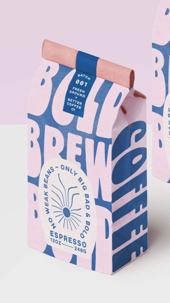 Bold coffee packaging with Fresh Ground label, pink and blue design, emphasizing bold espresso beans.