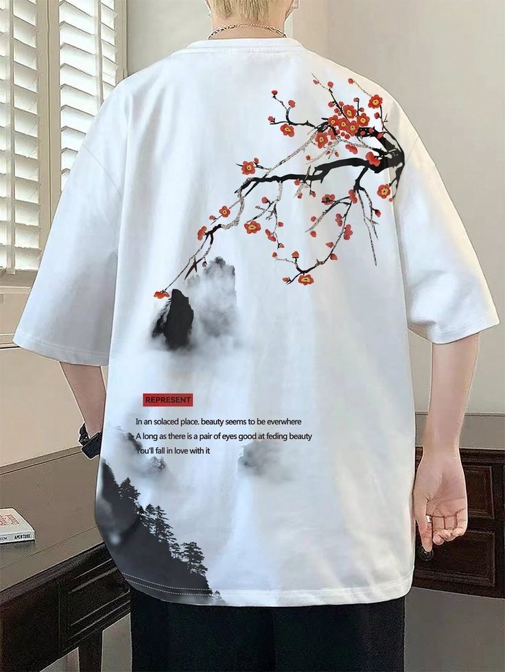 White T-shirt with artistic floral and text design on back, featuring red blossoms and inspirational words.
