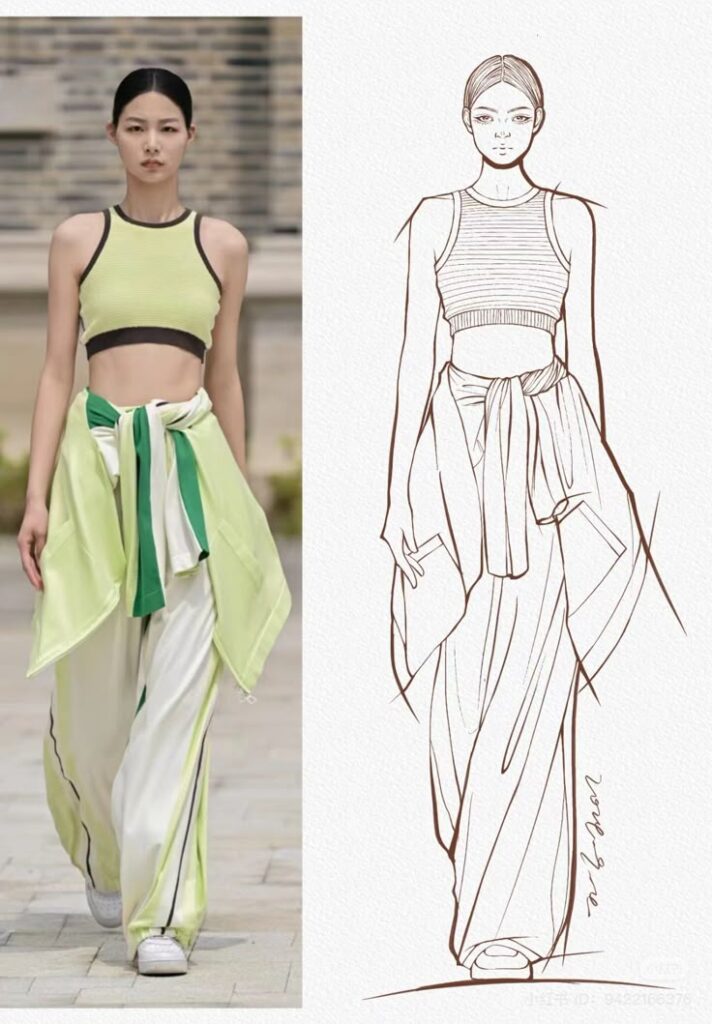 Model in a green crop top and wide pants with a matching sketch on the right. Fashion runway look with artistic design.