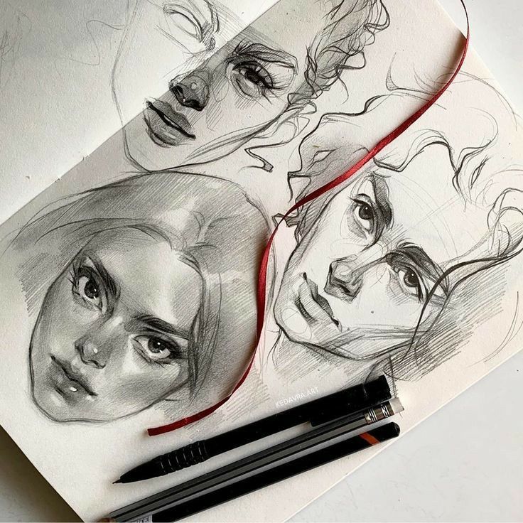 Sketchbook page showcasing detailed pencil drawings of faces with pencils and a red ribbon.