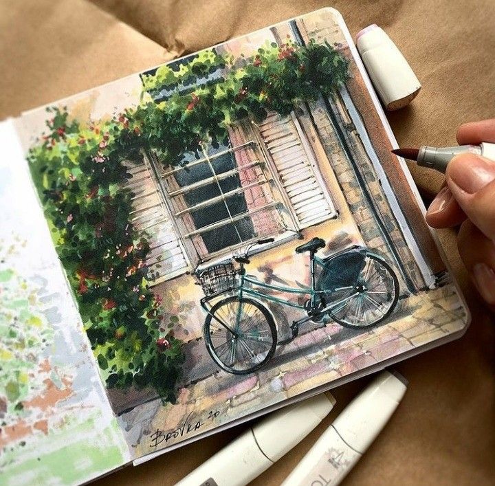 Artist sketching a picturesque scene of a bicycle by a rustic window, surrounded by lush greenery.