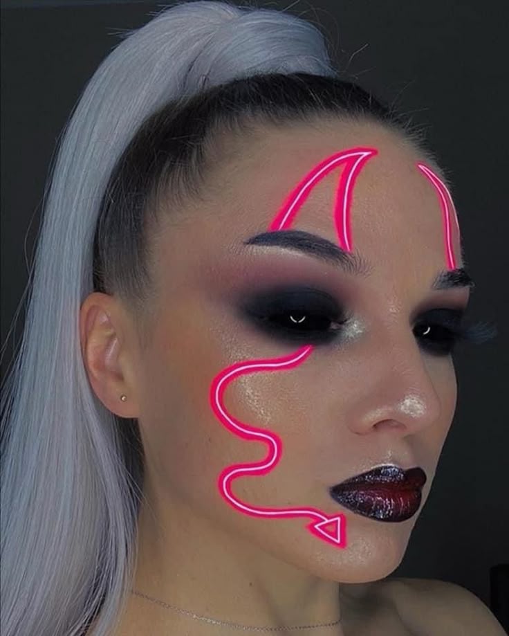Creative makeup with neon pink lines and dark smoky eye on a woman with long, platinum blonde hair in a high ponytail.