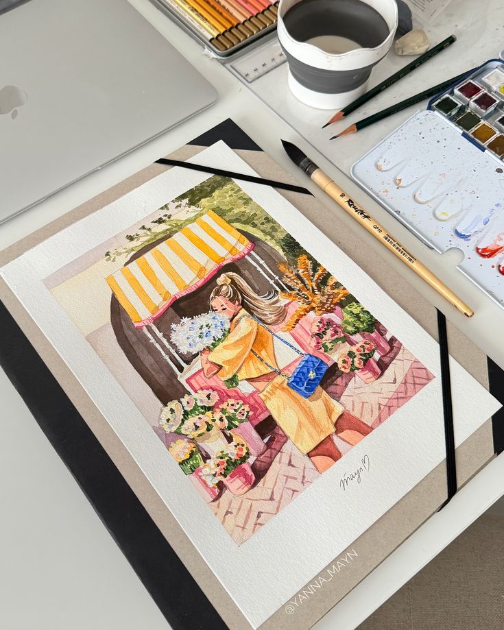 Watercolor painting of a woman at a flower shop, surrounded by art supplies and a laptop.