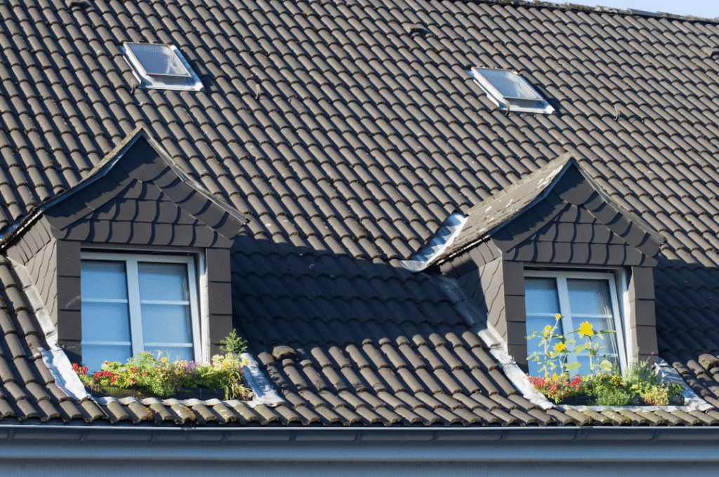 image Roof with two dormer windows, small gardens of colorful flowers under each, and skylights above. | Sky Rye Design Roof with two dormer windows, small gardens of colorful flowers under each, and skylights above.
