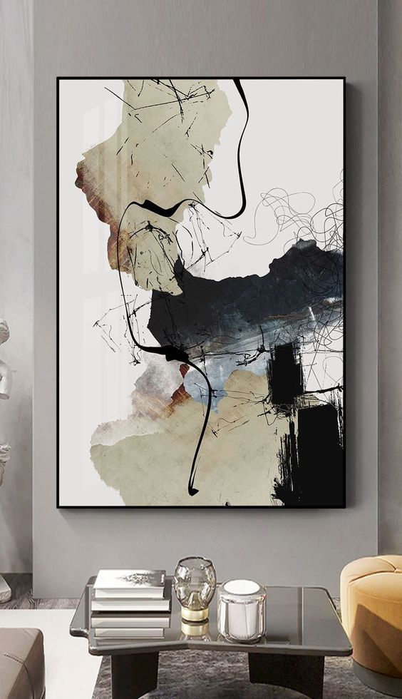 Abstract wall art with bold black, beige, and gray brushstrokes in a modern living room.