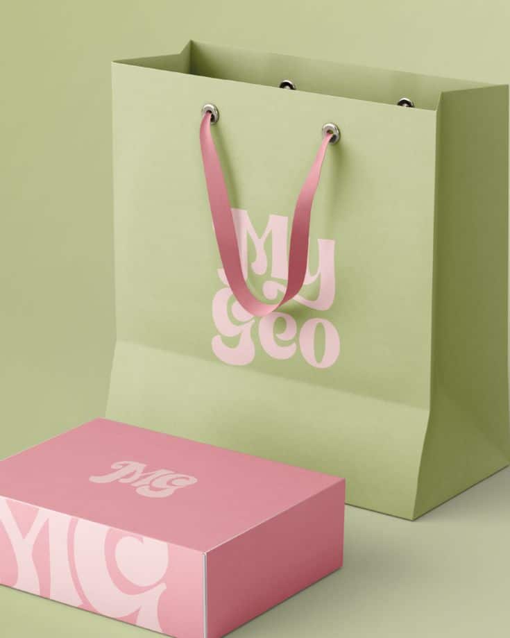 Green shopping bag and pink box set with My Geo branding on pastel background.