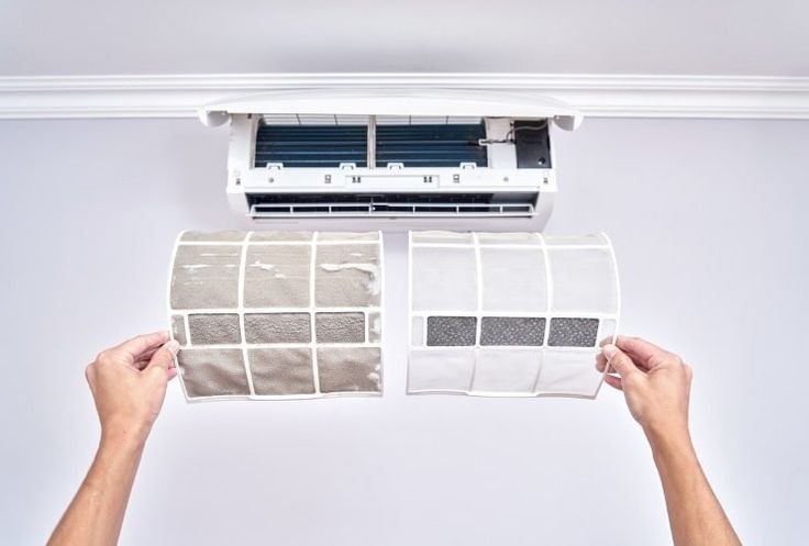 Comparing clean and dirty air conditioning filters under a split AC unit for maintenance insights.