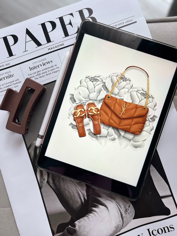 Визуал иллюстратора Tablet displaying fashion items on a floral background with a magazine and a hair clip nearby. | Sky Rye Design Tablet displaying fashion items on a floral background with a magazine and a hair clip nearby.