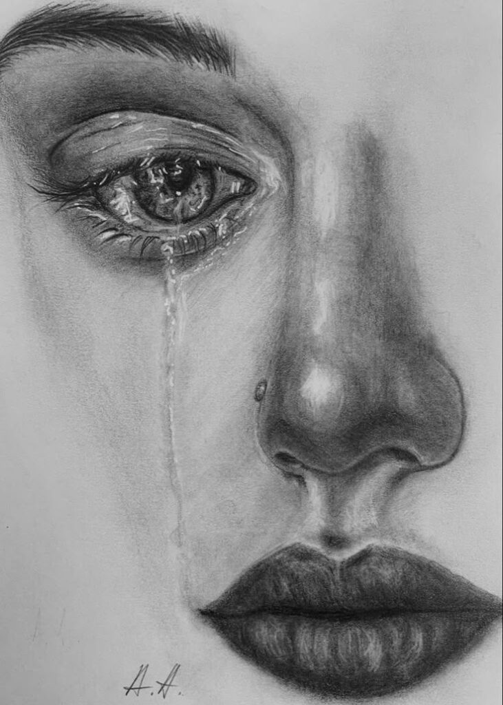 Pencil sketch of a face in closeup, showing a detailed eye with a tear and expressive lips. Realistic emotional artwork.