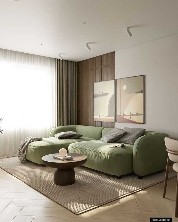 Modern living room with green sofa, wooden panels, and abstract art. Bright space with natural light and cozy accents.