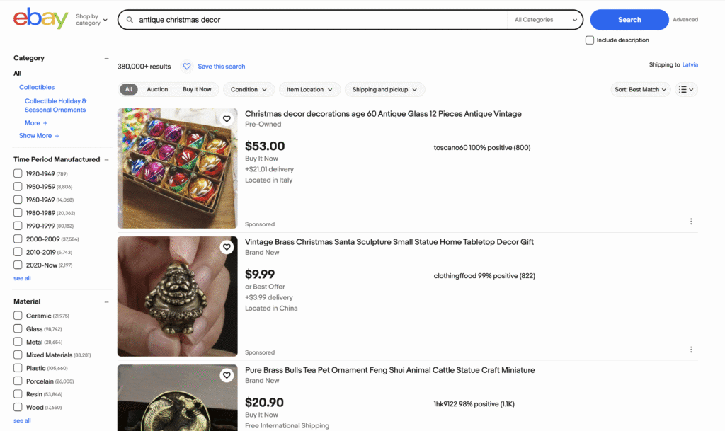 eBay search results for antique Christmas decor, featuring vintage glass ornaments and brass sculptures.