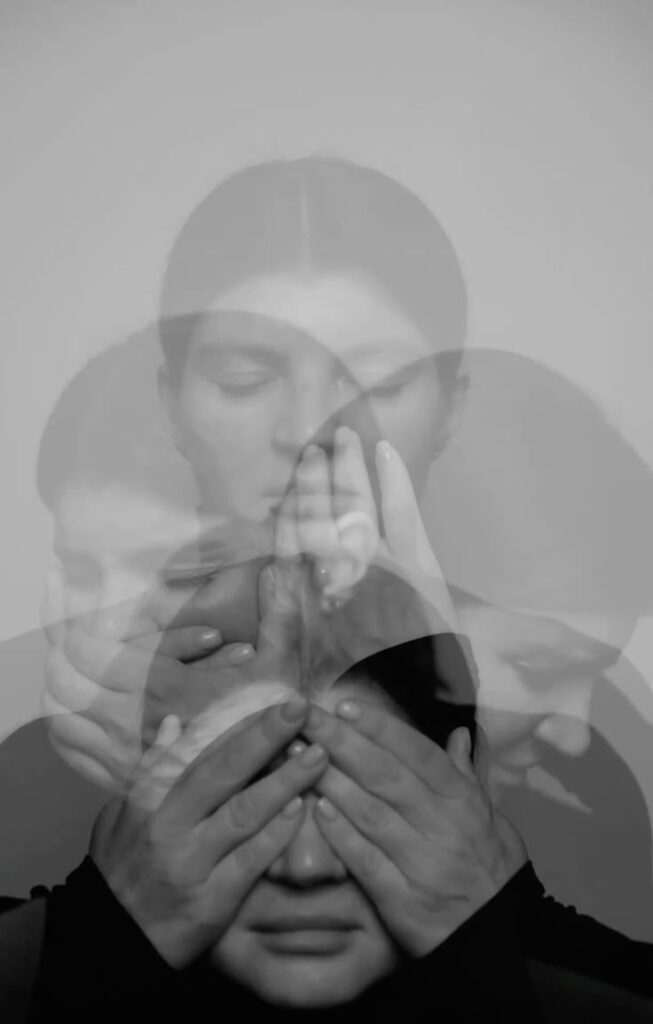 Multiple exposures of a woman in grayscale, hands covering her face and eyes, conveying emotion and introspection.