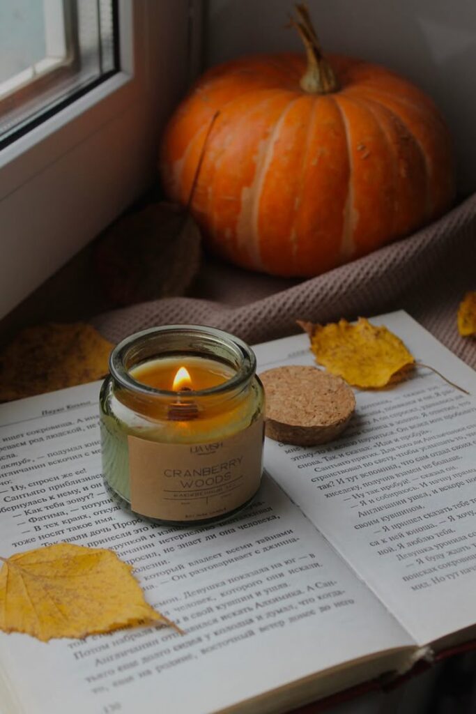 Ароматические свечи для уютного вечера lia_vish Фото и видео в Instagram Cozy autumn scene with a lit candle on an open book, surrounded by a pumpkin and autumn leaves. | Sky Rye Design Cozy autumn scene with a lit candle on an open book, surrounded by a pumpkin and autumn leaves.