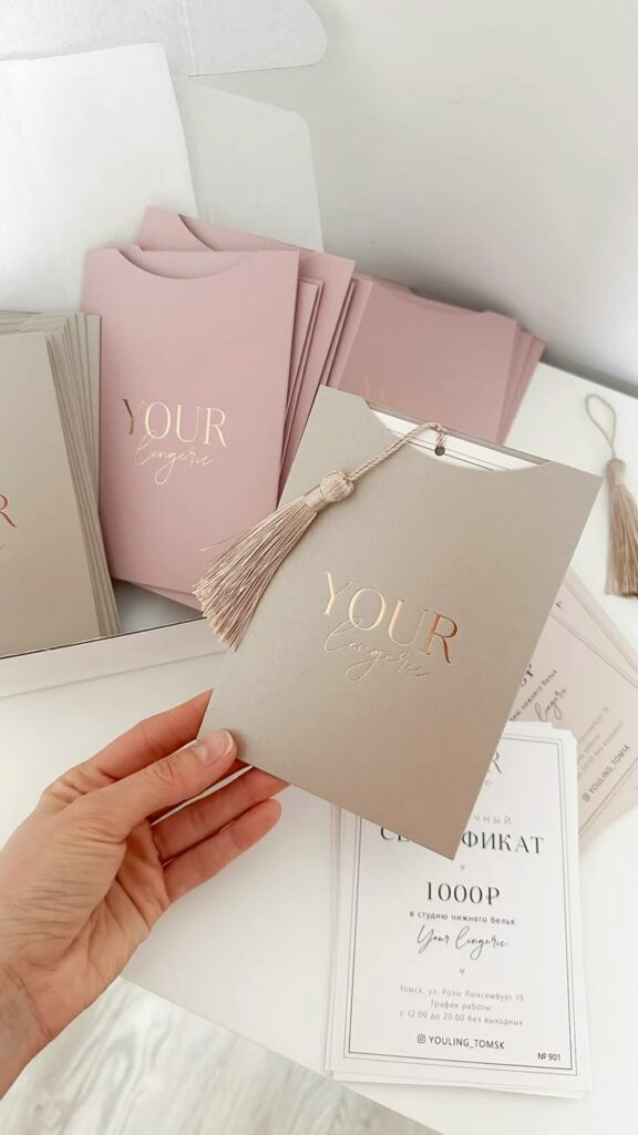 Нежные подарочные сертификаты с кисточками Elegant lingerie gift cards with tassels, featuring Your Lingerie branding, perfect for special occasions. | Sky Rye Design Elegant lingerie gift cards with tassels, featuring Your Lingerie branding, perfect for special occasions.