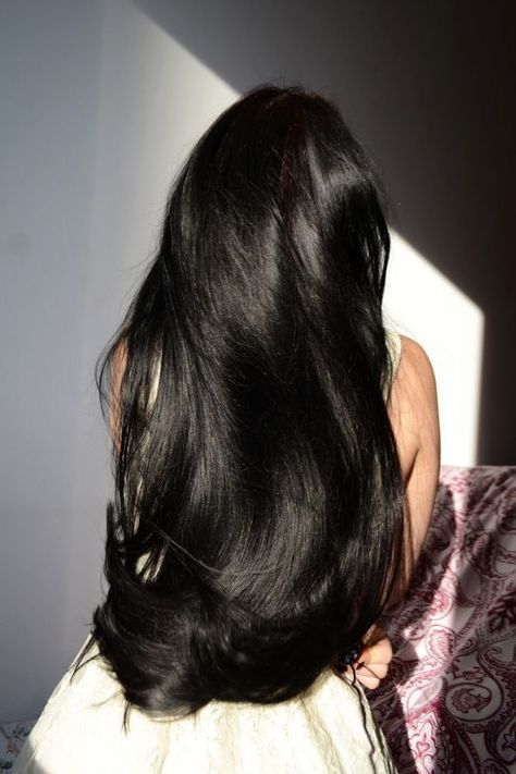 ✨ Long, shiny black hair flowing down a woman's back in soft light. | Sky Rye Design Long, shiny black hair flowing down a woman's back in soft light.