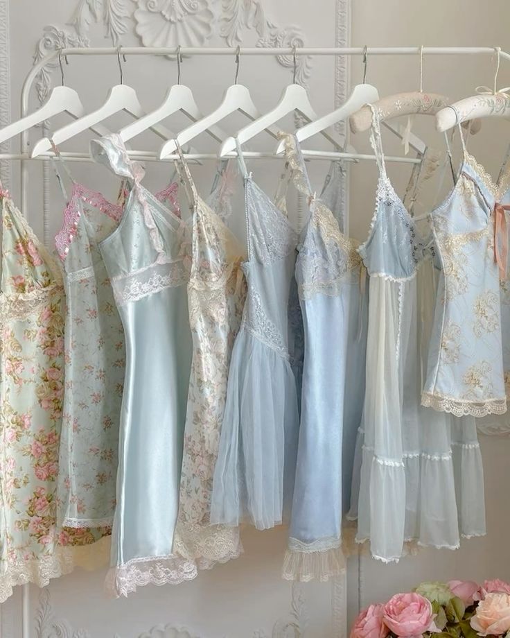 _ 1 Elegant pastel lingerie with lace detailing on hangers, perfect for a feminine and vintage-inspired wardrobe. | Sky Rye Design Elegant pastel lingerie with lace detailing on hangers, perfect for a feminine and vintage-inspired wardrobe.