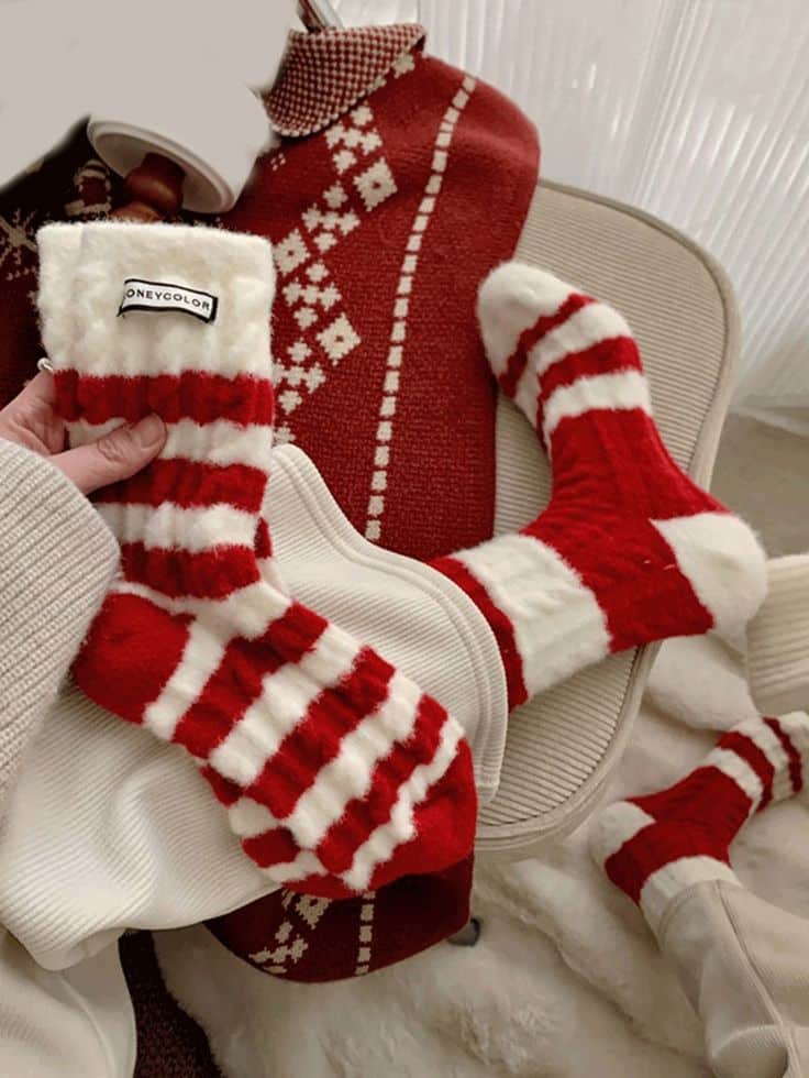 1 Pair Winter Christmas Australian Fleece Socks With Red Stripes Womens Mid Tube Socks Christmas Socks With Warm And Super Soft Fleece Red Socks Cozy red and white striped socks on a winter-themed chair with a matching hot water bottle cover. | Sky Rye Design Cozy red and white striped socks on a winter-themed chair with a matching hot water bottle cover.