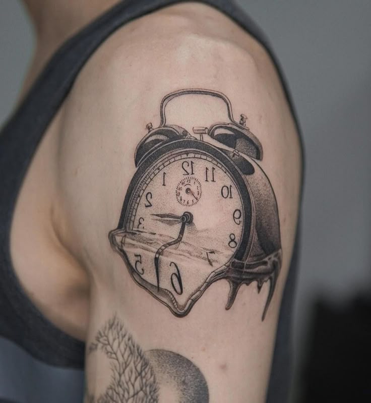 Surreal melting clock tattoo on upper arm, inspired by Salvador Dalí, blending time and art seamlessly.