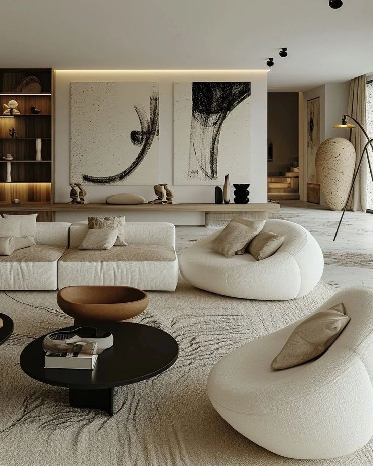 _ 11 Modern living room with abstract art, cozy white sofas, and elegant round tables. Neutral tones and stylish decor. | Sky Rye Design Modern living room with abstract art, cozy white sofas, and elegant round tables. Neutral tones and stylish decor.