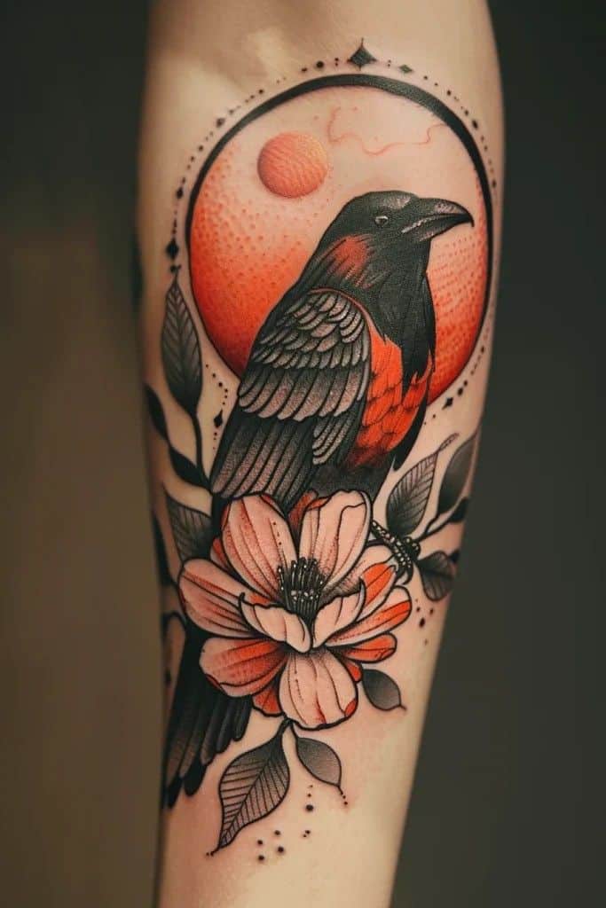 Vibrant tattoo of a black and red bird with flowers and sun, on a forearm, showcasing nature-inspired art.