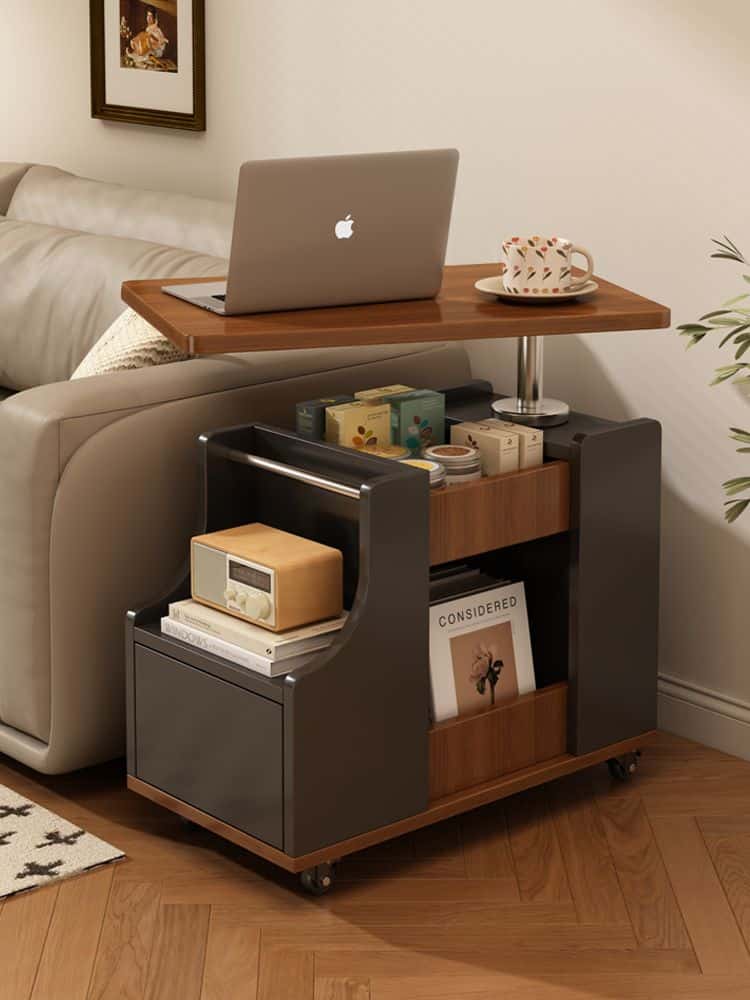 14afea0f63d470d74b26bf9449b373dd Compact rolling desk with a laptop and coffee, beside a sofa, featuring shelves with books and storage. | Sky Rye Design Compact rolling desk with a laptop and coffee, beside a sofa, featuring shelves with books and storage.