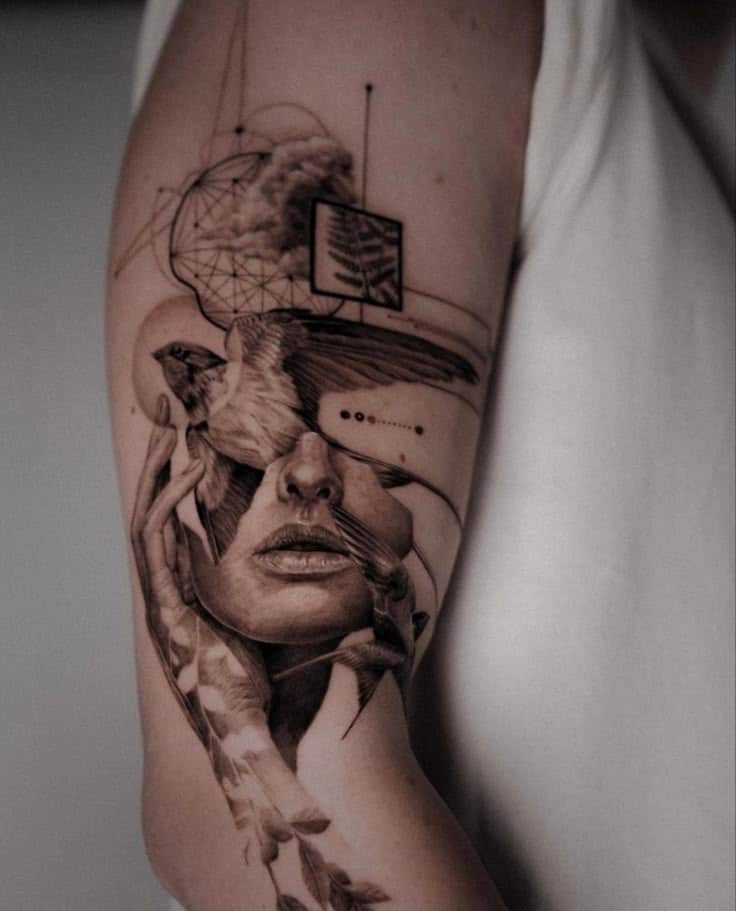 Abstract tattoo on arm with woman’s face, bird, geometric design, and nature elements in monochrome style. realism tattoo