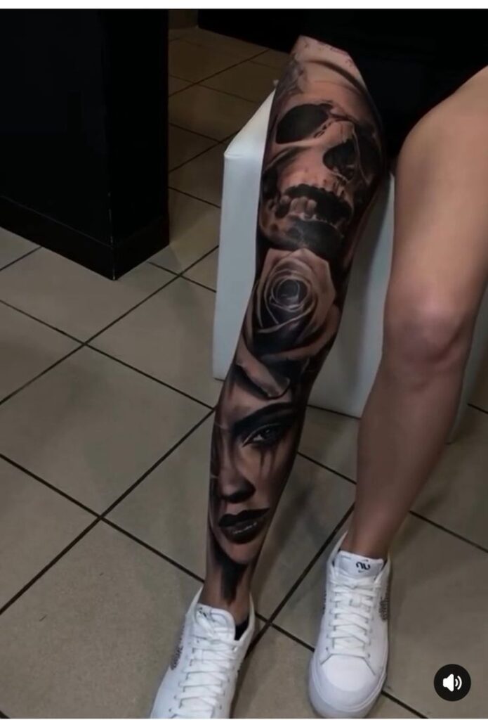 _ 17 Intricate full leg tattoo featuring a skull, rose, and woman's face in black and gray shading. | Sky Rye Design Intricate full leg tattoo featuring a skull, rose, and woman's face in black and gray shading.