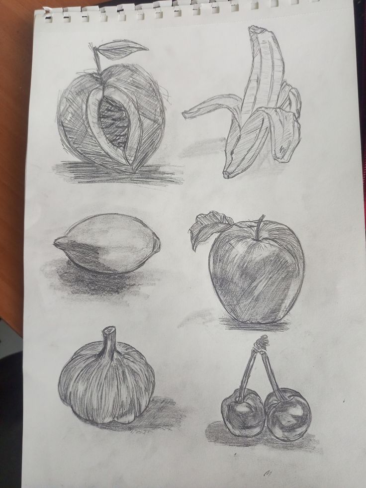 Pencil sketches of various fruits: peach, banana, lemon, apple, garlic, and cherries on a notepad.