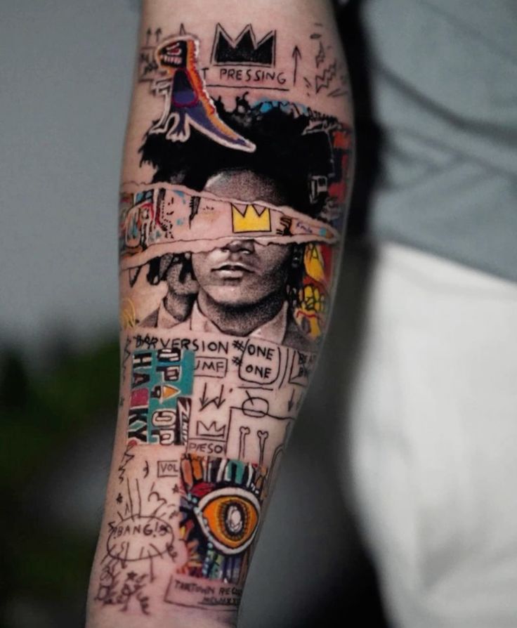 Colorful abstract tattoo art on arm featuring portraits, symbols, and graffiti-style elements.