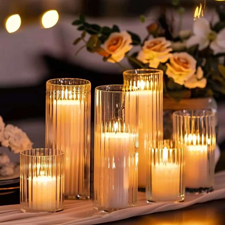 Version 100 Elegant candles in glass holders with warm glow, surrounded by roses, creating a romantic ambiance. | Sky Rye Design Elegant candles in glass holders with warm glow, surrounded by roses, creating a romantic ambiance.