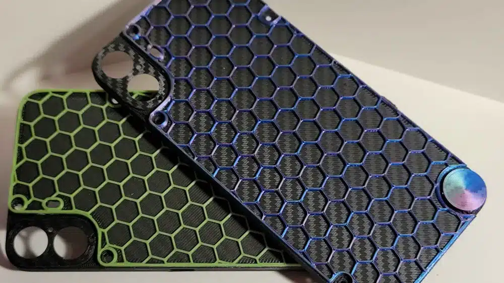 2024-07-23_e7a53cbaf0d3c 1 Two phone cases with hexagonal patterns, in blue and green, showcasing a stylish, modern design. | Sky Rye Design Two phone cases with hexagonal patterns, in blue and green, showcasing a stylish, modern design.